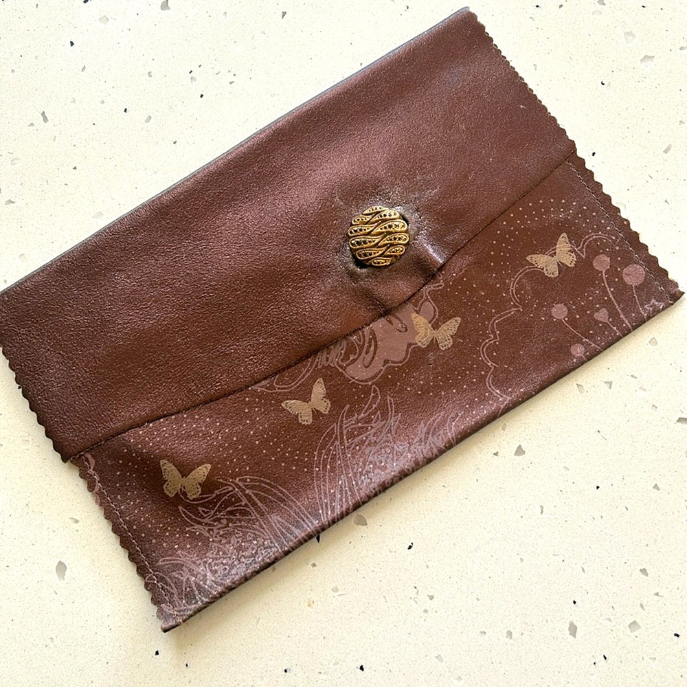 Kimchi painted leather clutch with gold button closure